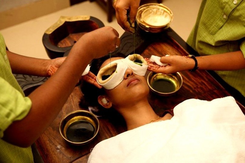 A person receiving Tarpanam therapy, with medicated ghee applied around the eyes to nourish, rejuvenate, and improve eyesight